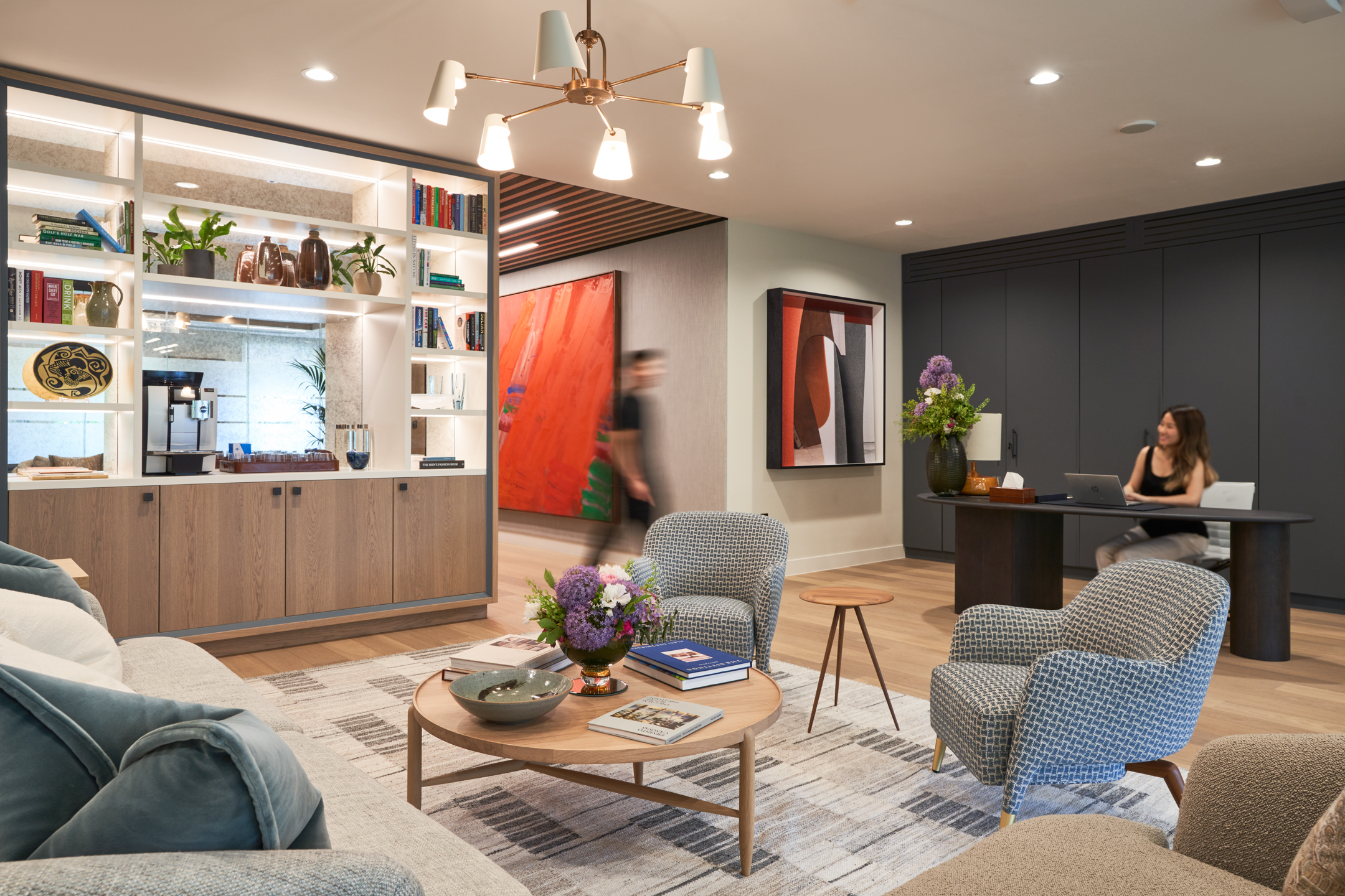 A collaborative breakout space with stylish furniture, promoting a relaxed atmosphere at Asset Management Firm, designed by Modus Workspace.