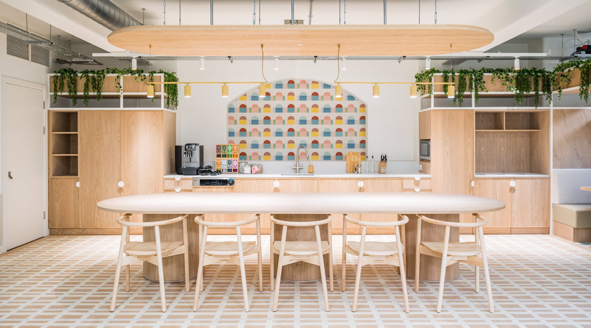 Fora Wells Mews bright teapoint with white and beige colours, and a vibrant backdrop central to the space.