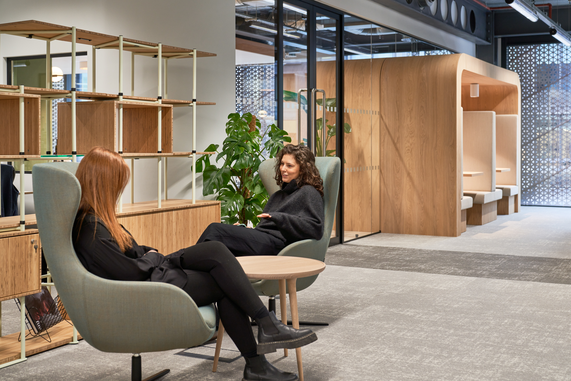 Investment Firm seating area with happy team members utilising the space.