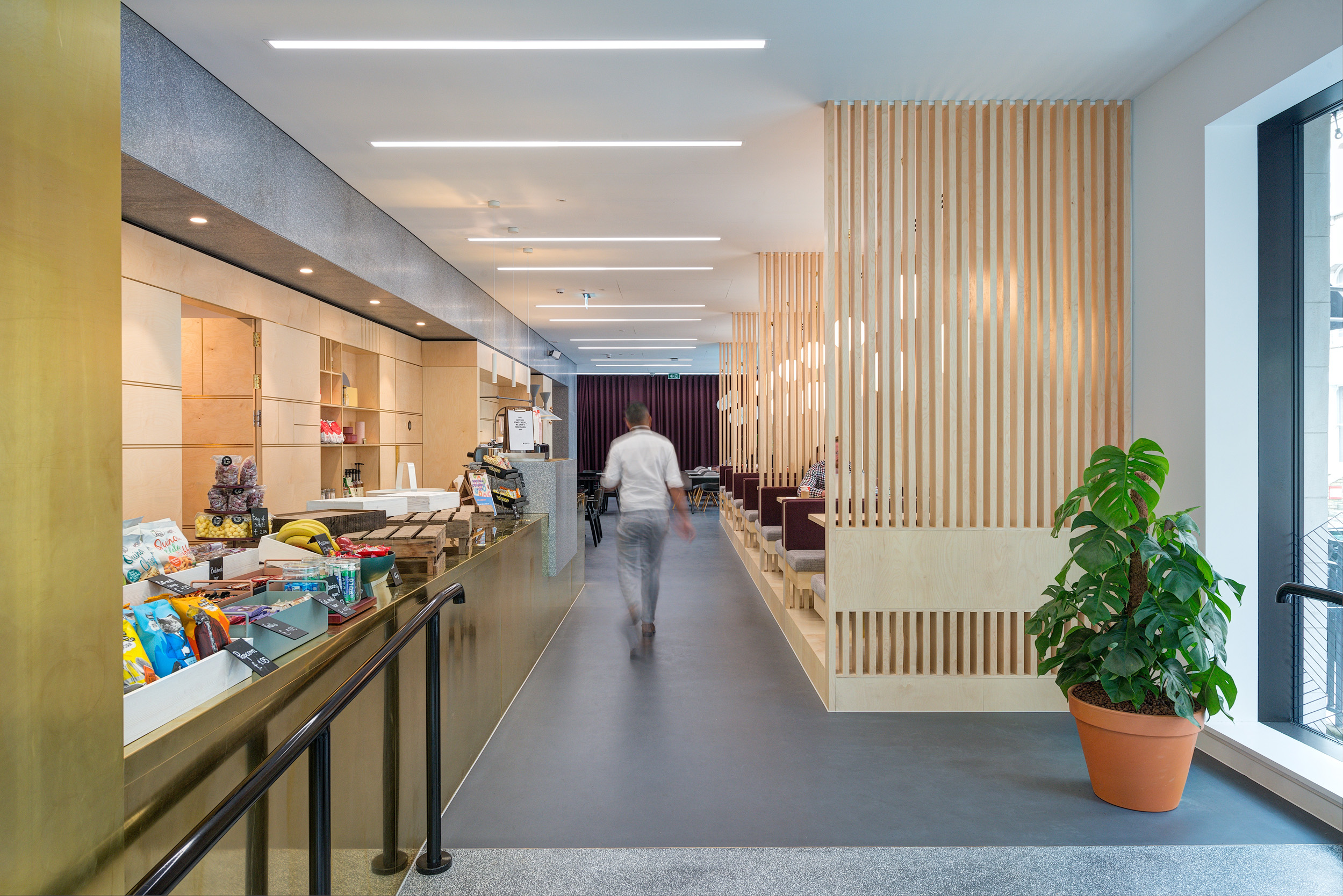 Cafe with light wood finishes, a serving counter, and cosy seating at Spaces Harley Building in Fitzrovia.