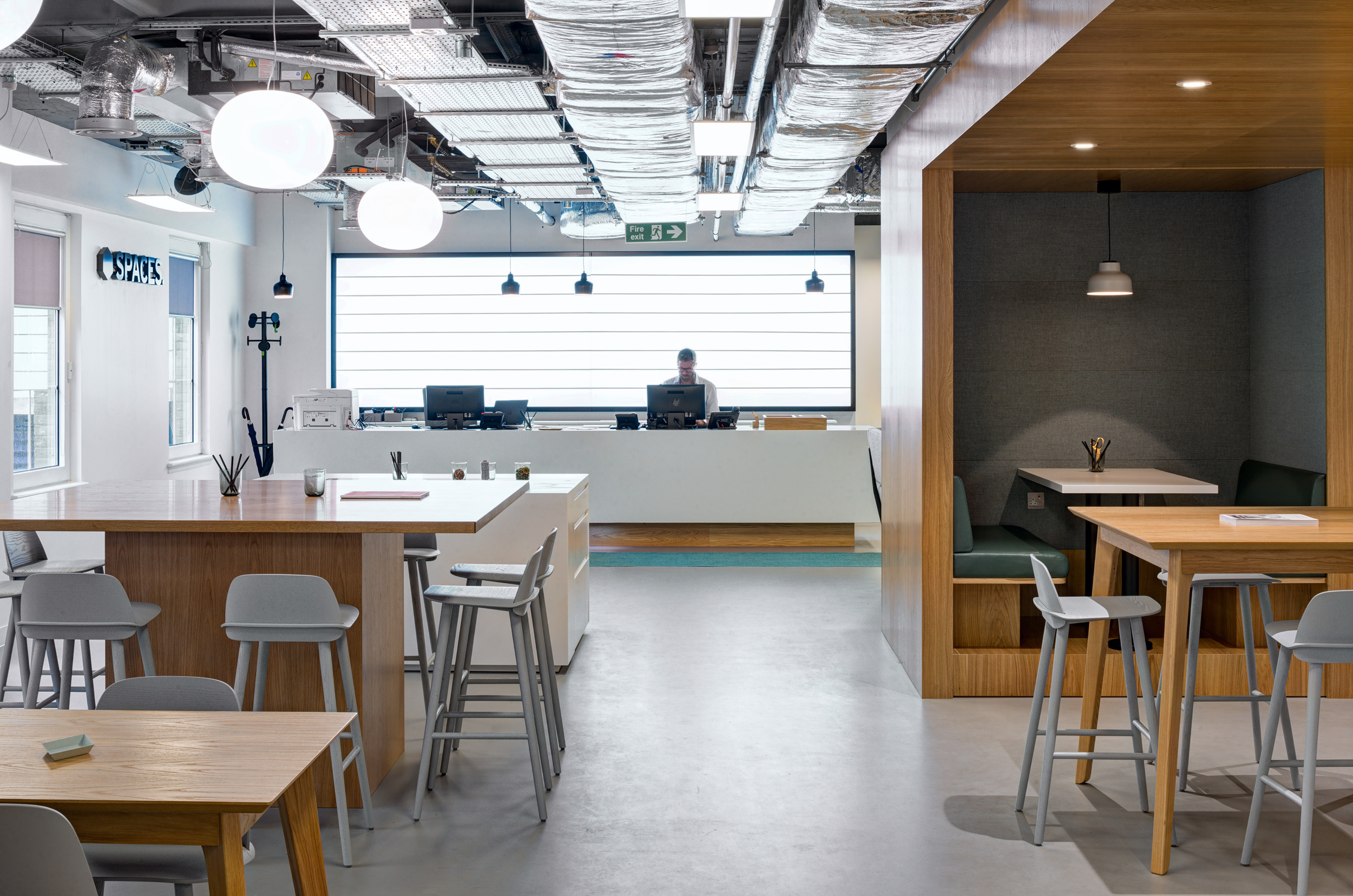 A bright and modern reception area at Spaces Mocatta House in Brighton welcomes visitors with a sleek, minimalist design.
