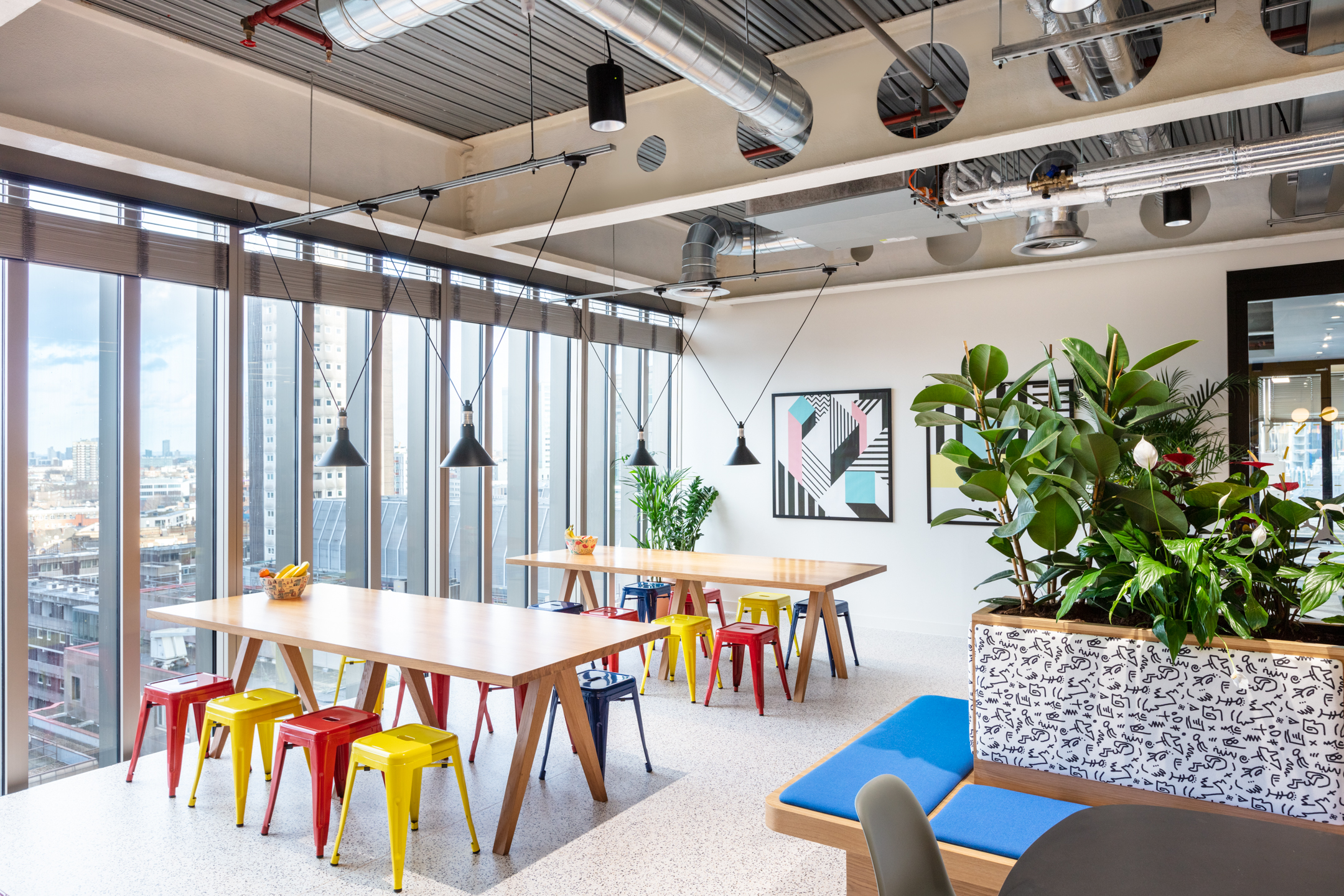 Travelfusion vibrant teapoint seating a area, with an immersive view over the City of London.