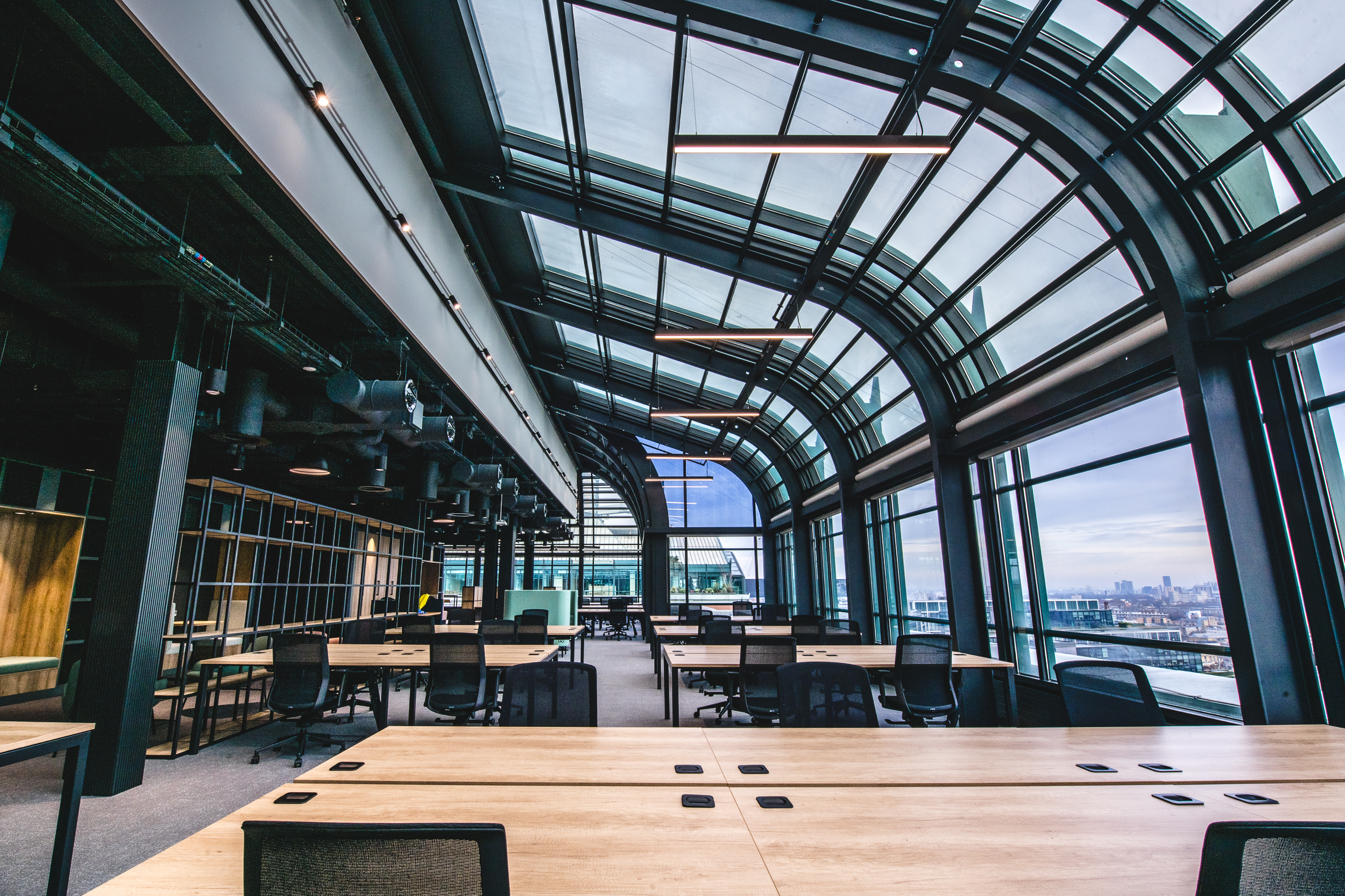 135 Bishopgate futuristic open-plan office with an immersive view of London, sleek finishes and a glass curved wall to ceiling finish