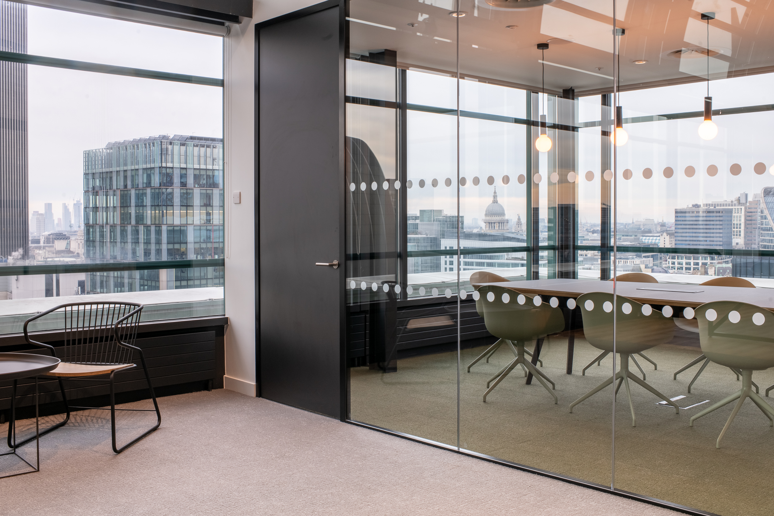 135 Bishopgate bespoke meeting room with acoustic panelling, frosted design on the glass walls, and an open, immersive view of London