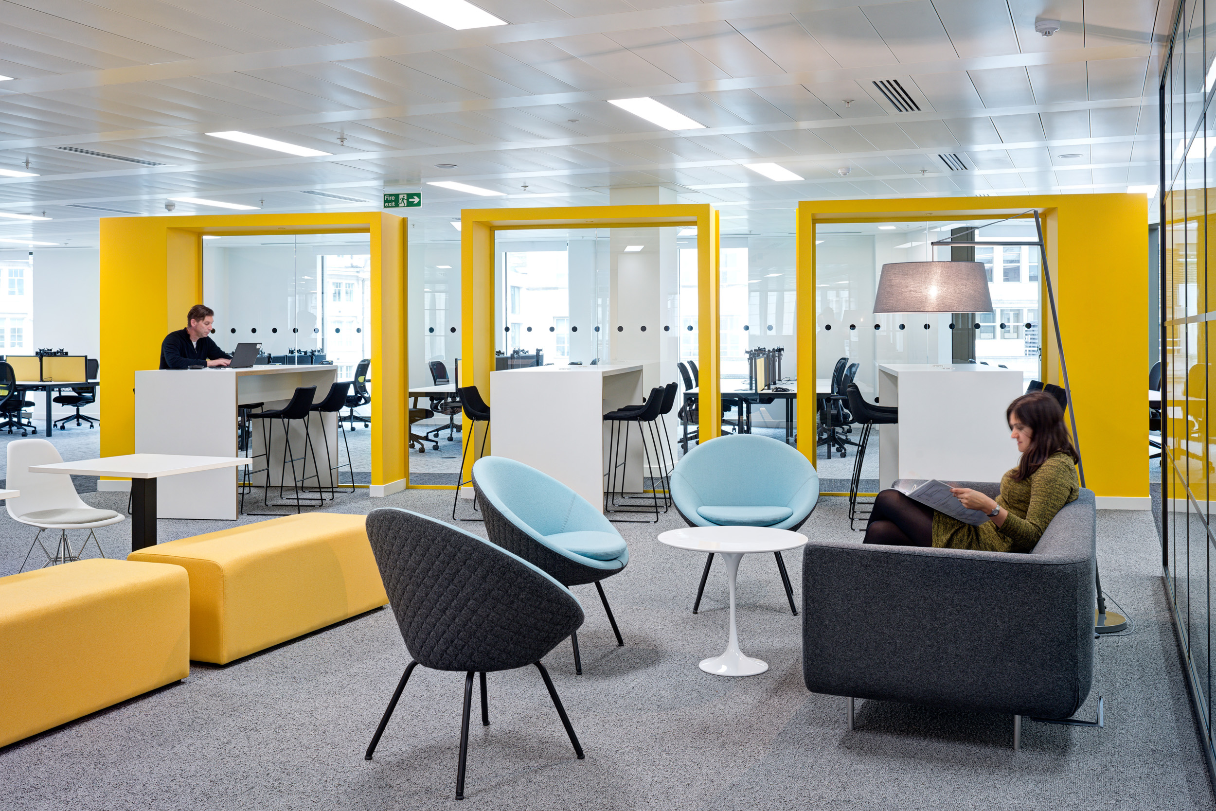 Breakout seating and work pods in Aldermore Bank’s office, promoting collaboration and casual meetings within a vibrant workspace.