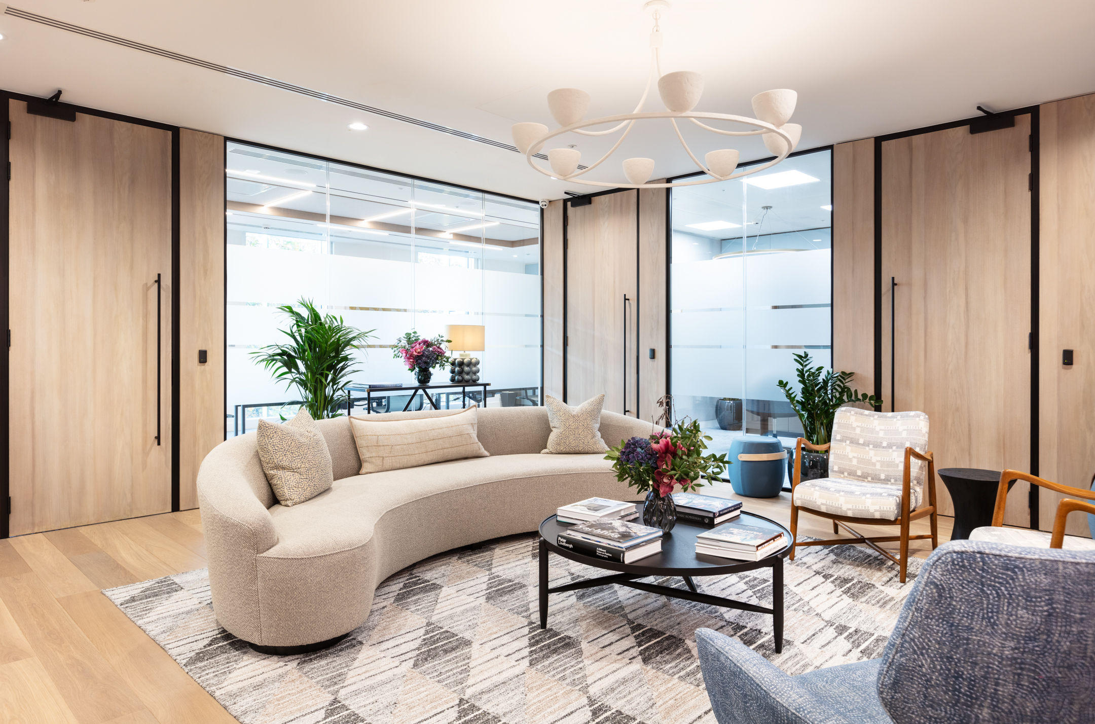 Luxurious reception seating area, designed by Modus Workspace, with cream furnishings and biophilic designs