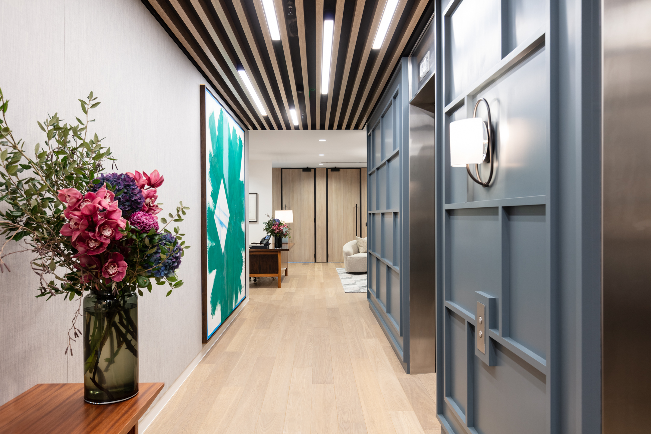 Asset Management hallway with bespoke artistic paintings and furnished rooms