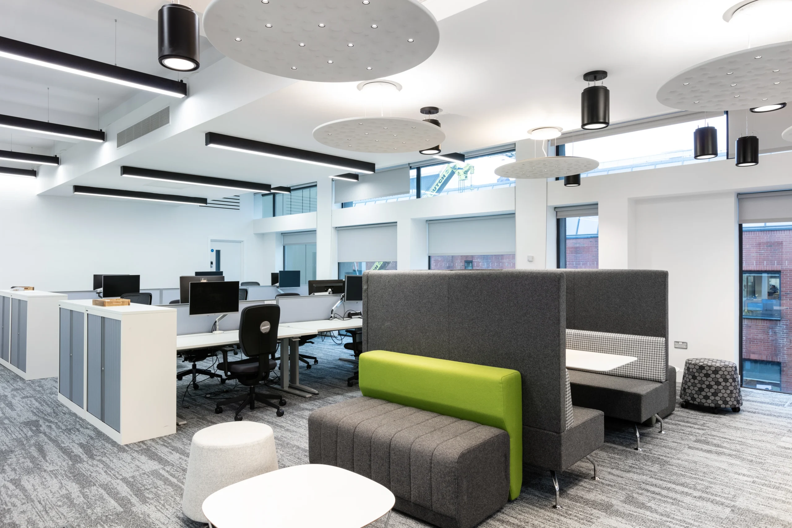 Workstations at Atkins, integrating open workstations and breakout booths.