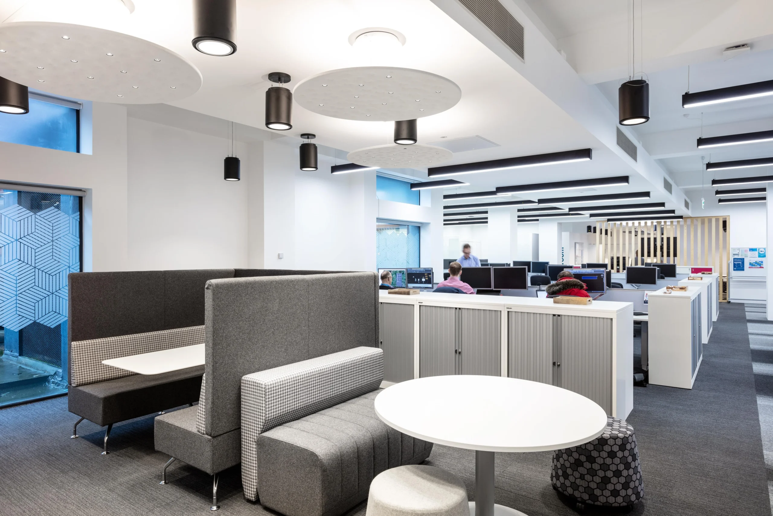 Quiet booth seating in Atkins' office, with acoustic-friendly materials and contemporary design.