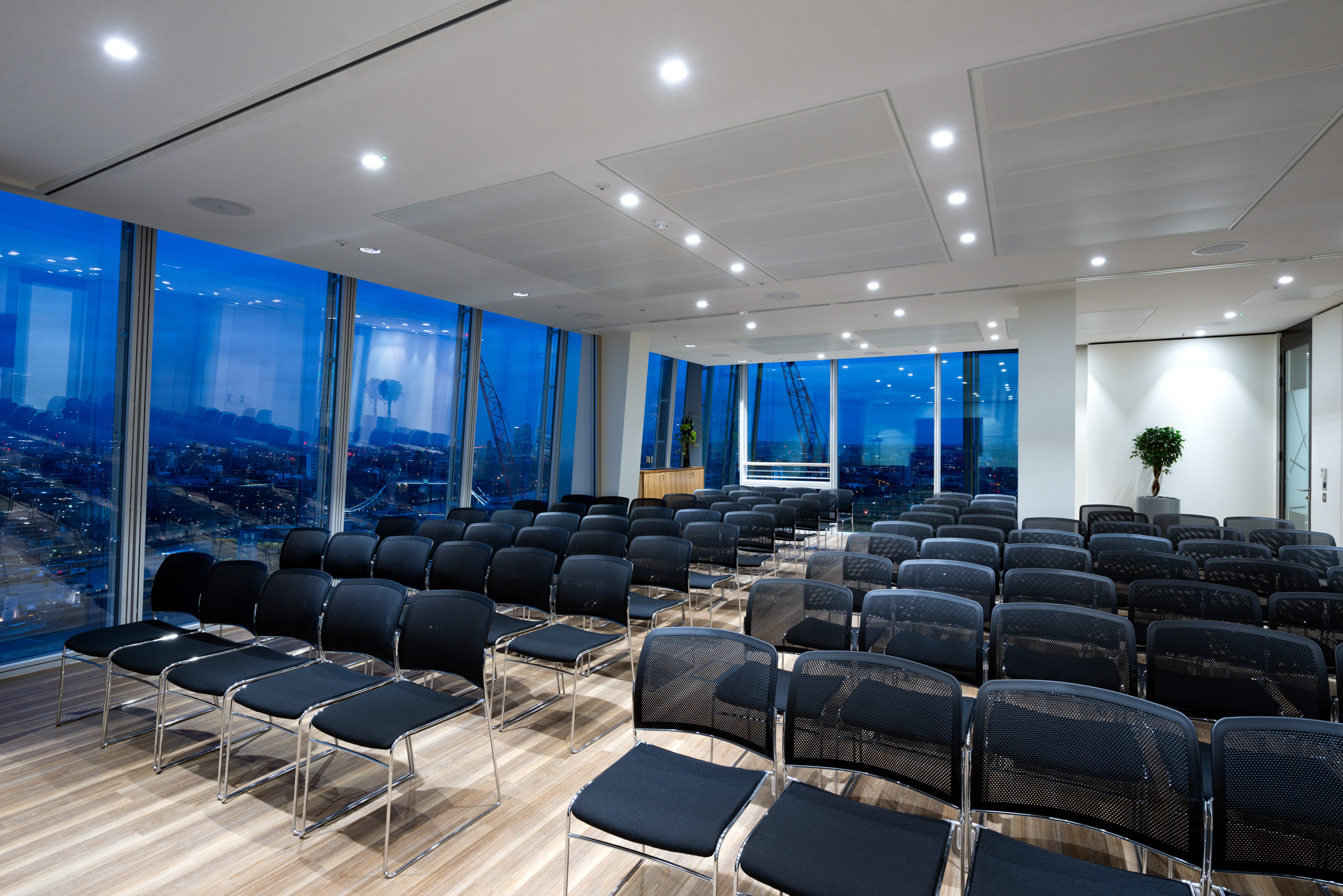 A spacious 50-person conference room at Foresight Group's office in The Shard, with panoramic views of the Thames and City of London through expansive windows.