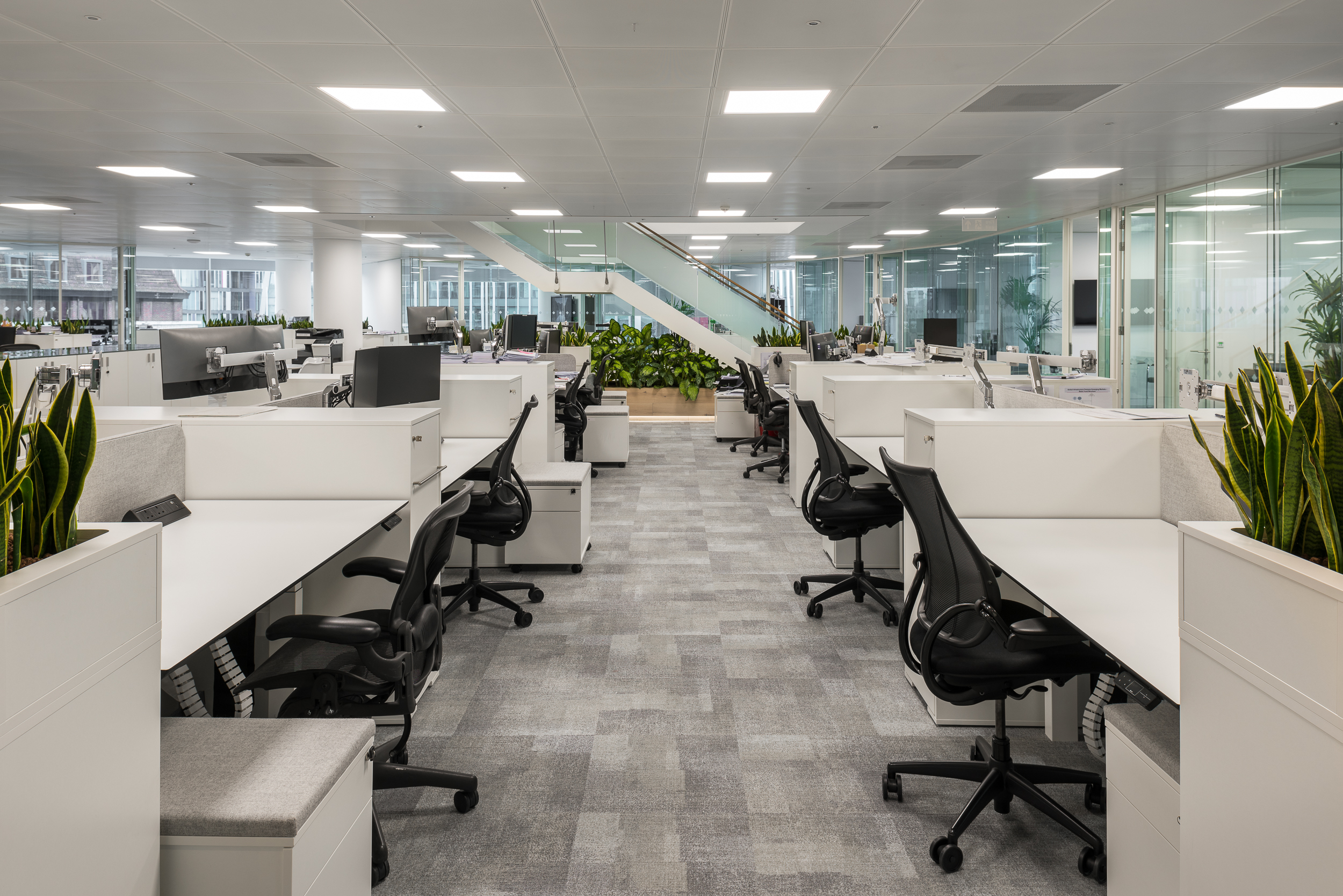 GIP's open desking area with ergonomic furniture and integrated storage solutions. The layout optimises space usage while maintaining a visually clean and organised environment.