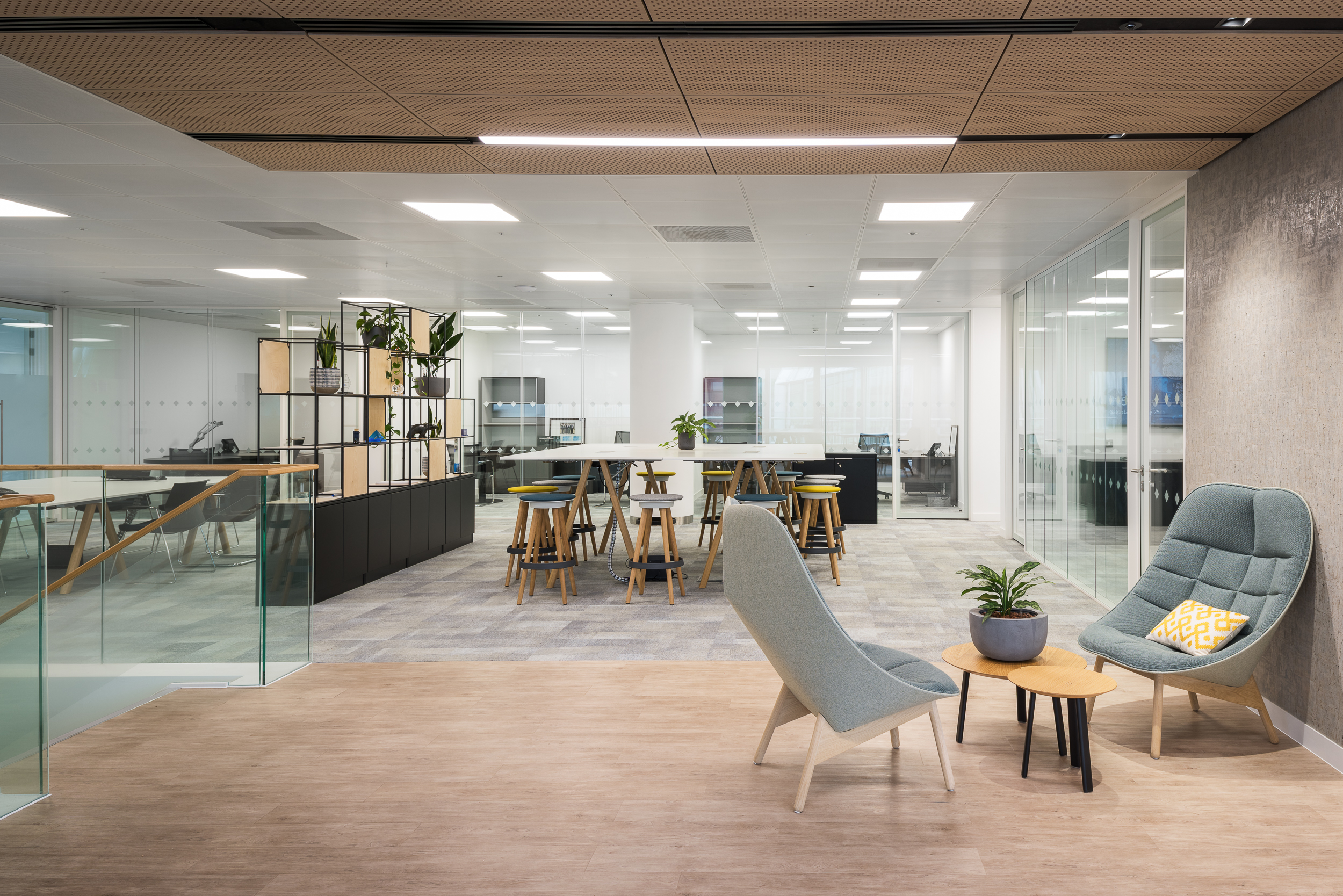 GIP's open-plan workspace with flexible seating and collaborative zones. The design allows for both private and team-focused work, supporting various work styles.