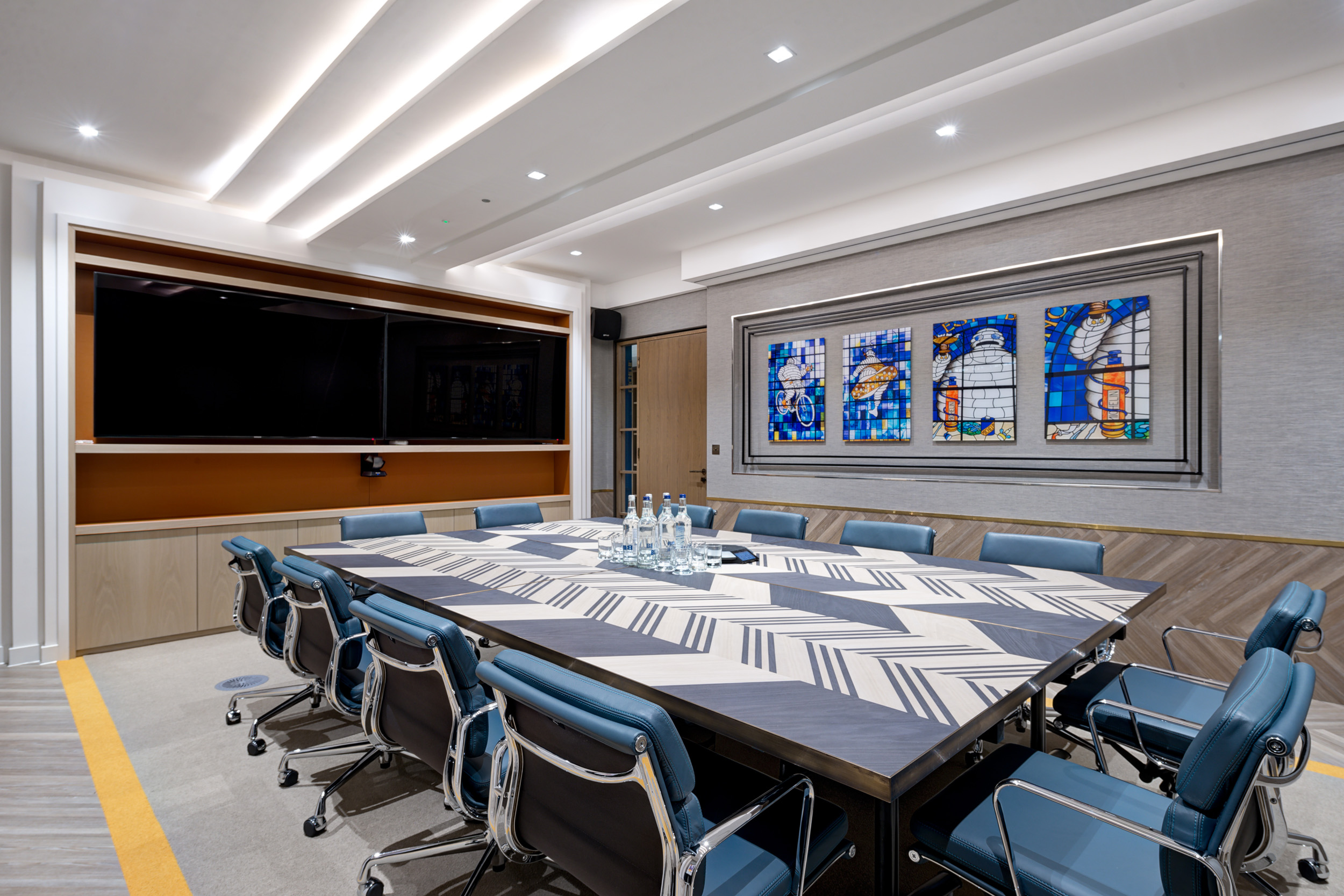 Executive boardroom at London Executive Office’s Michelin House, showcasing bespoke furniture and stained glass inspired by the building’s history.