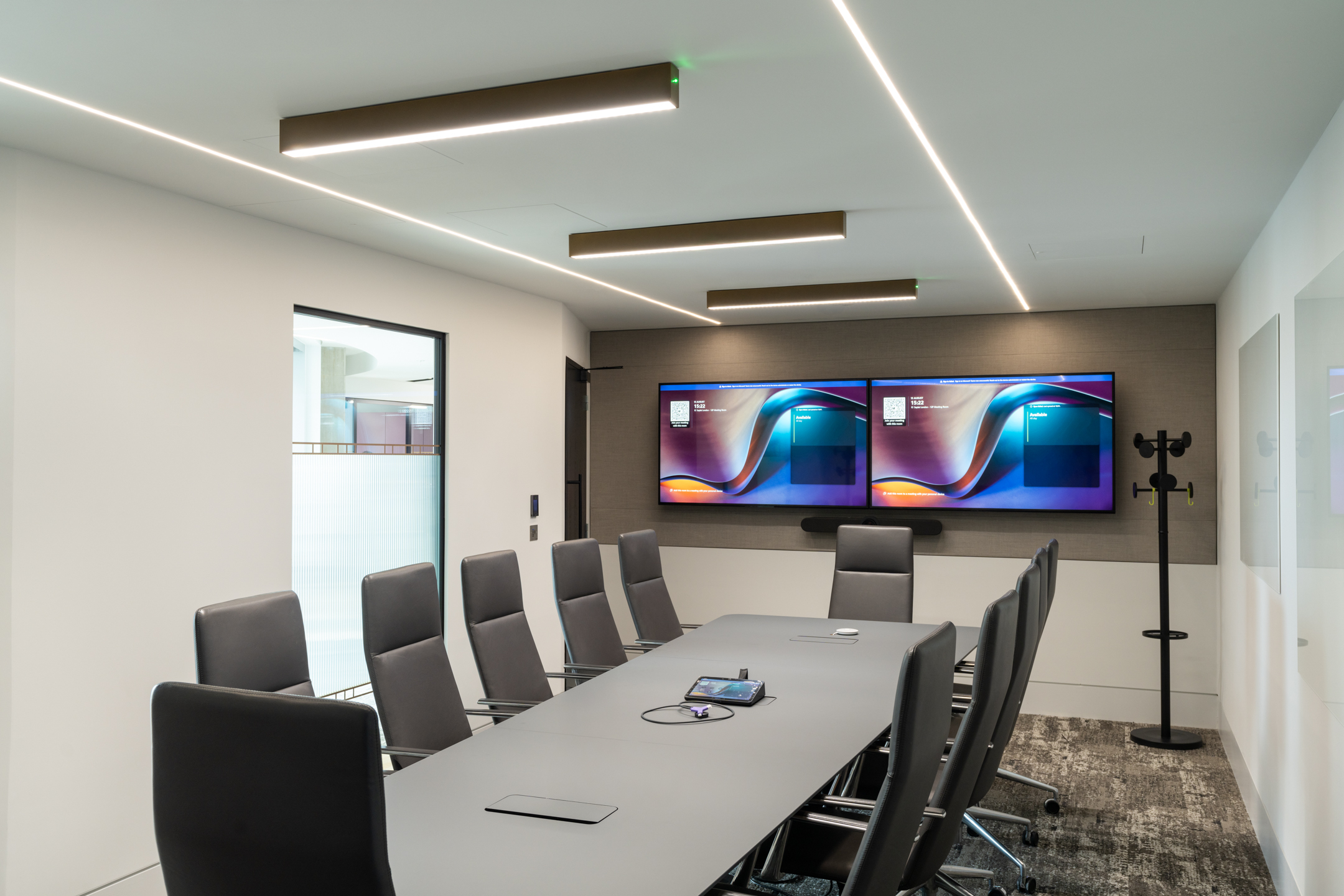 Seplat Energy's meeting room with a long conference table and dual screens for presentations.
