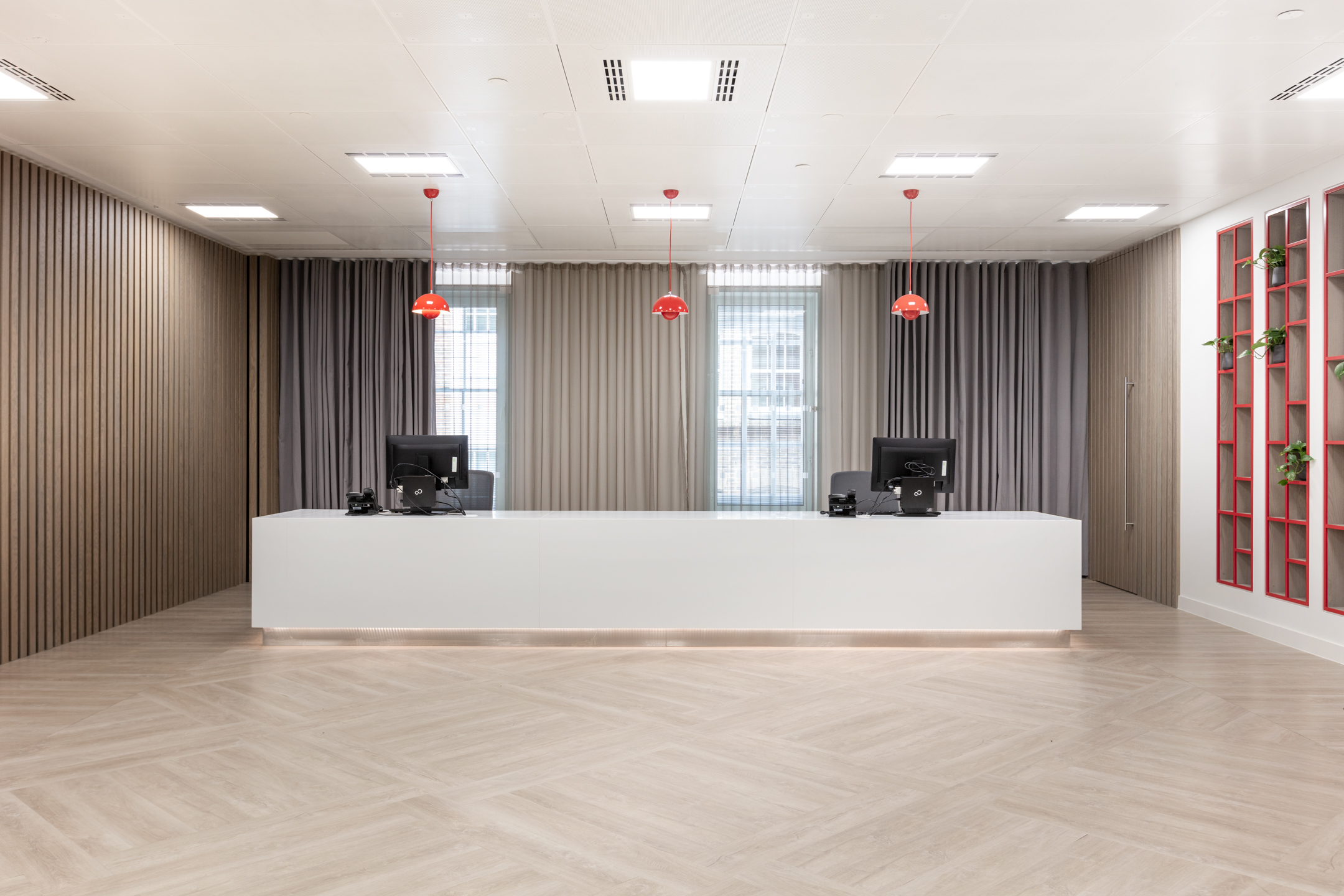 Wide view of the modern reception area at Fujitsu Services Marylebone, highlighting the clean and professional design by Modus Workspace.