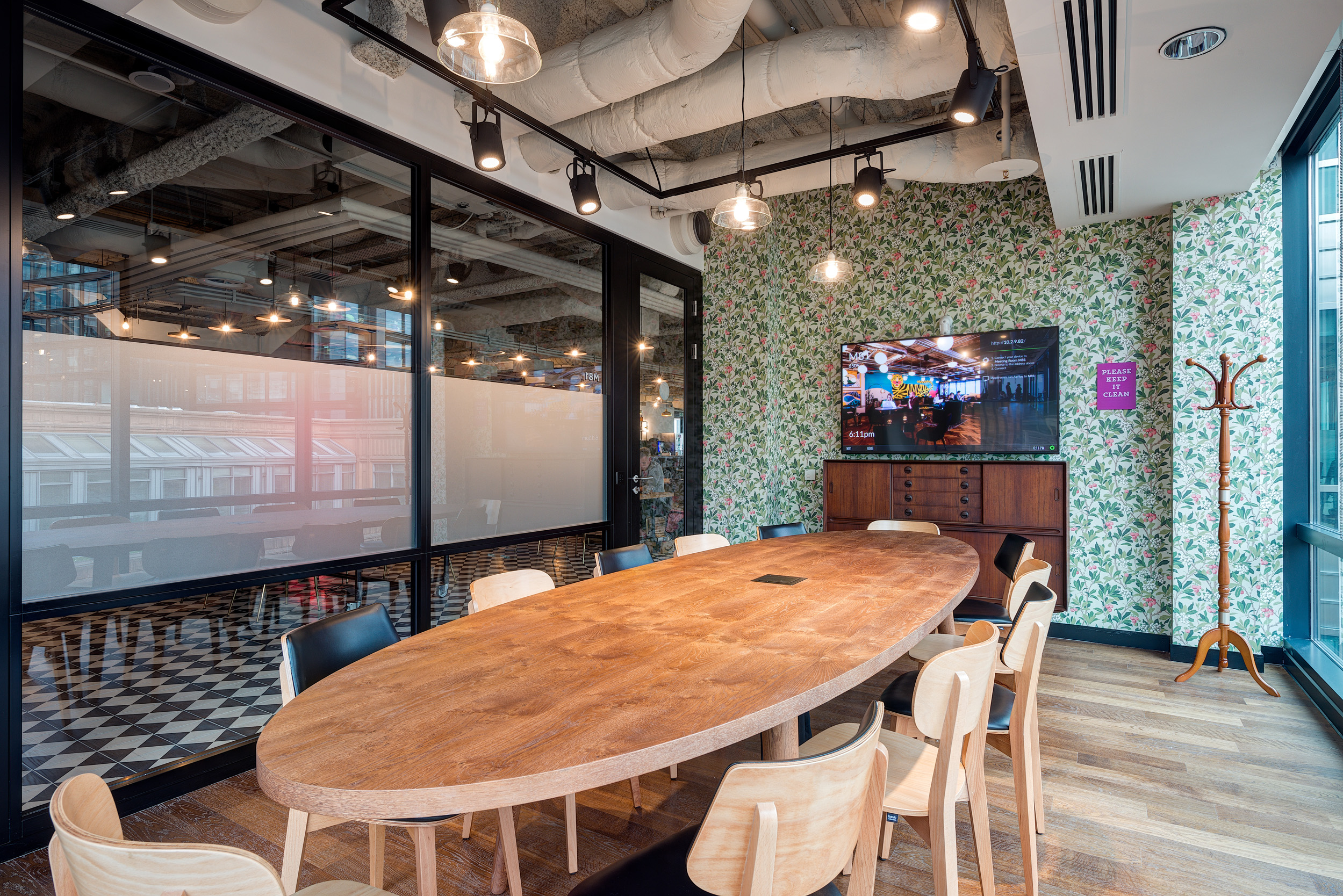 Mindspace Appold Street meeting room with a large wooden table and floral wallpaper, designed by Modus Workspace.