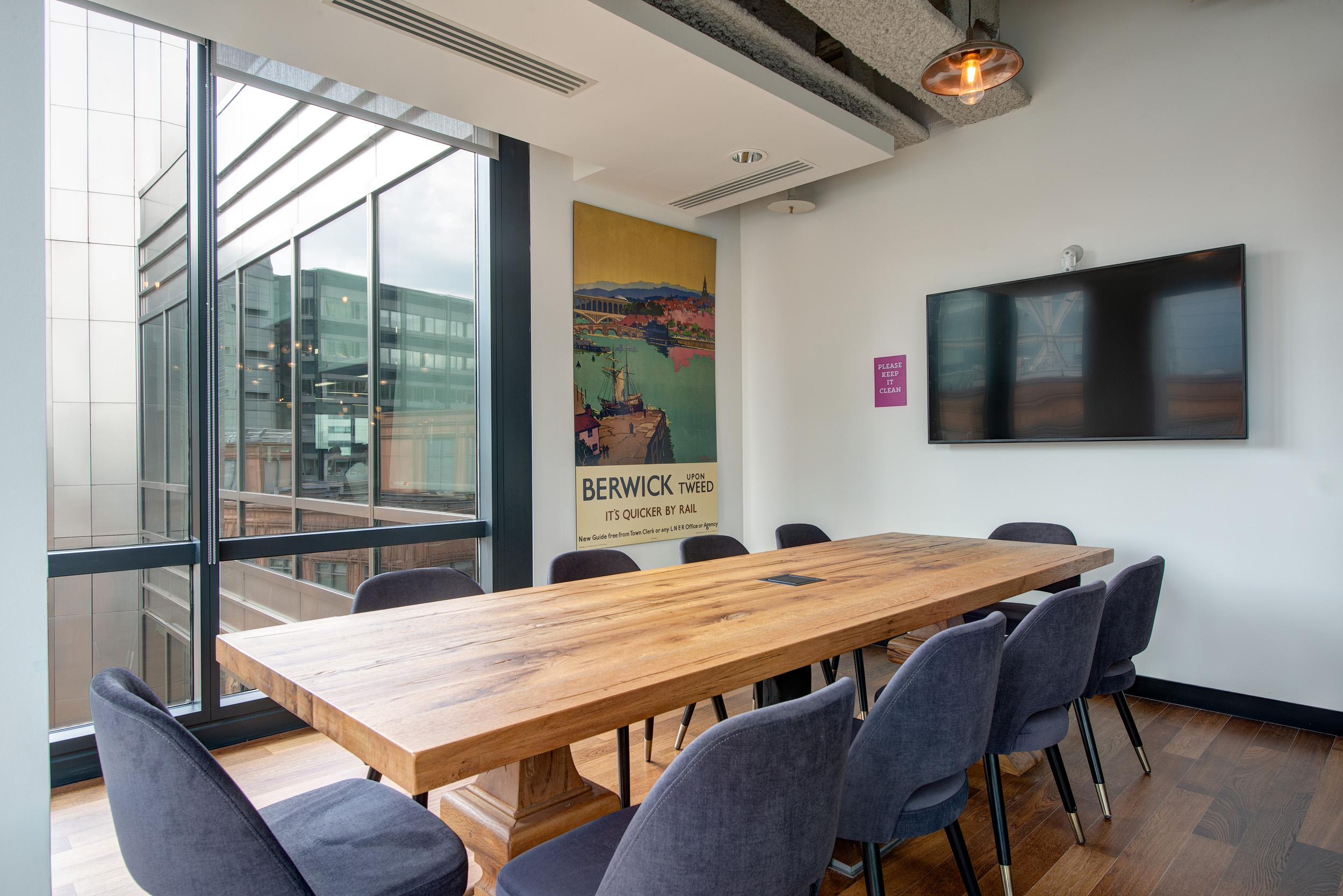 Mindspace Appold Street private meeting room with a wooden table and large windows, designed by Modus Workspace.