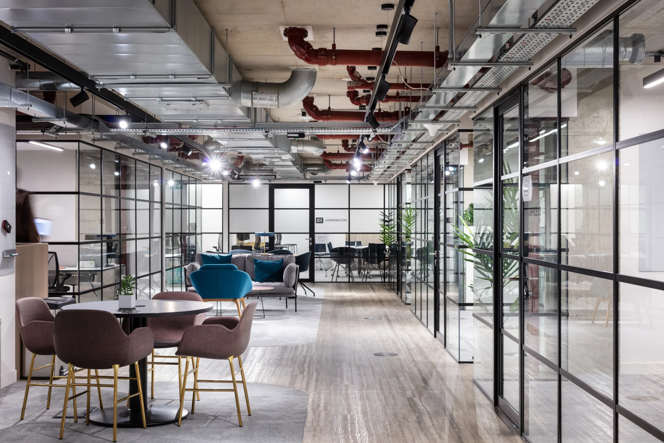 OSE central corridor at Oxford Science Enterprises, providing access to meeting rooms and communal workspaces designed for scientific collaboration.