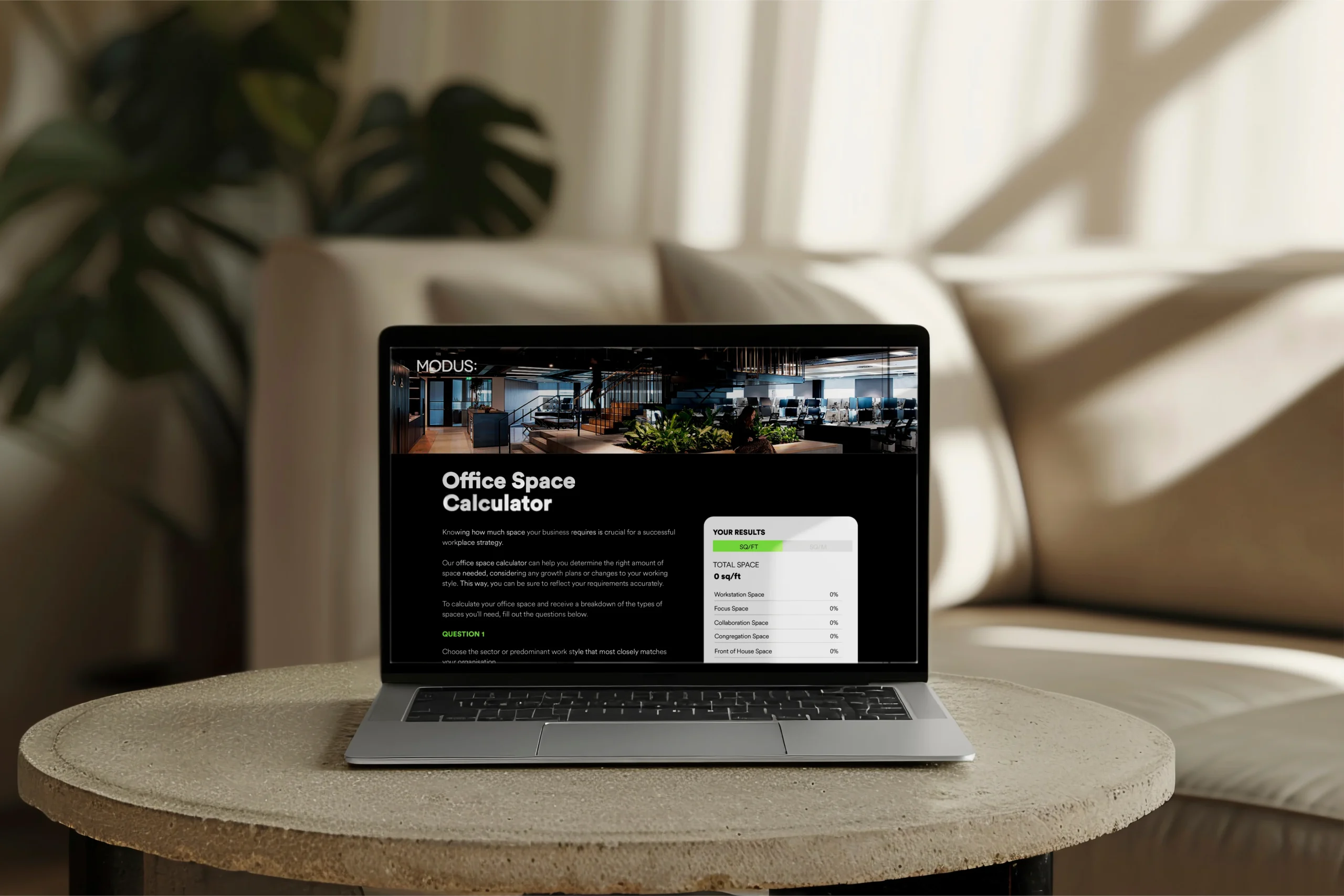 A laptop displaying the office space calculator tool, designed to provide data-driven insights for optimising workspace layout and improving spatial efficiency through advanced analytics.