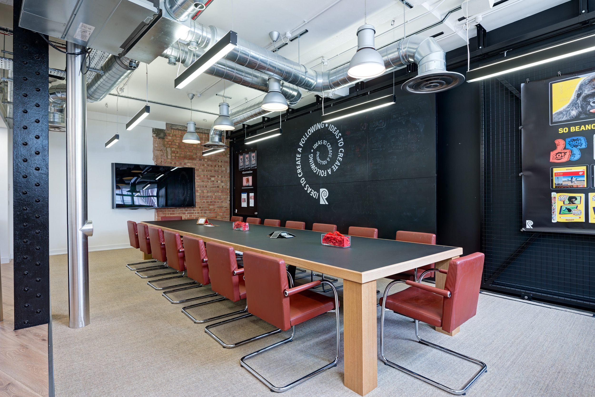 Another angle of the boardroom at Red Brick Road, showing the closed position of the sliding display wall used for creative meetings.