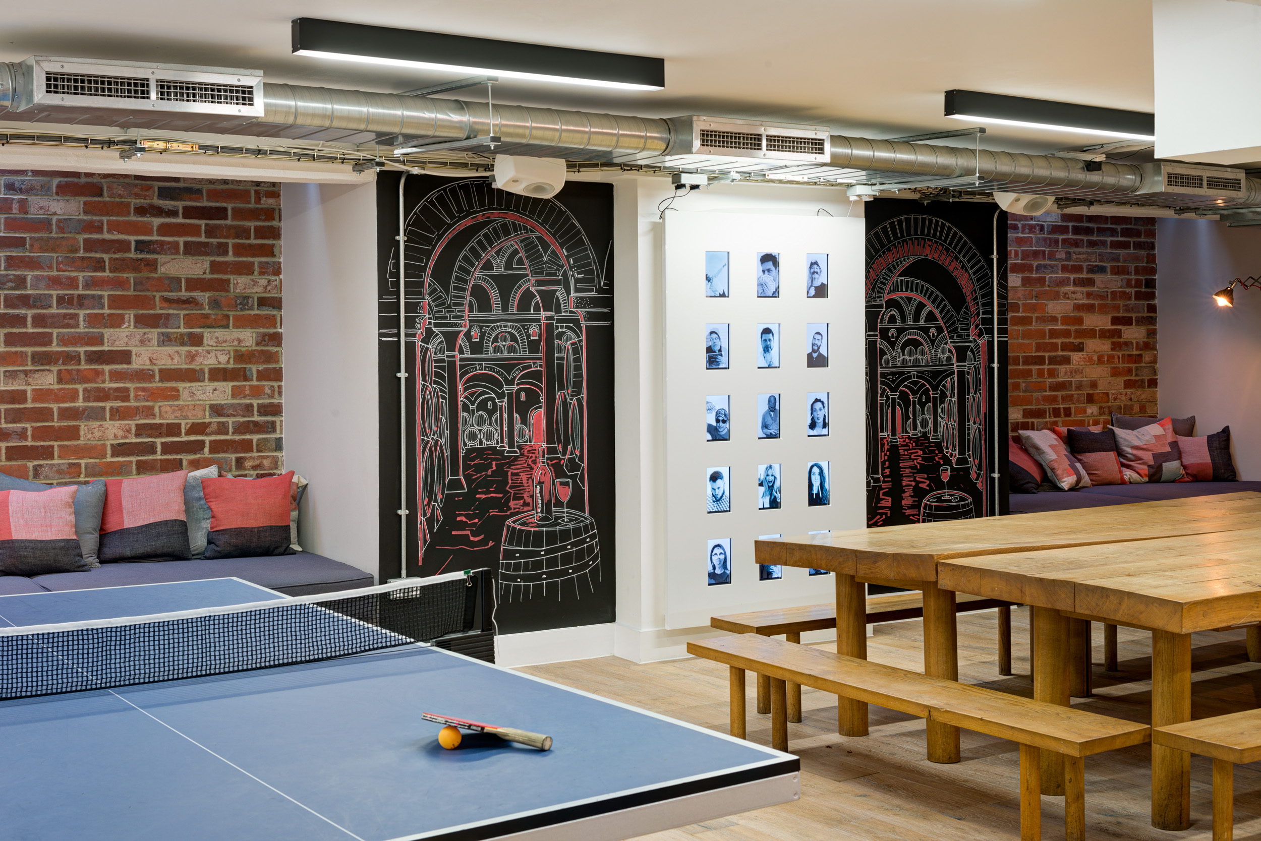 Breakout area in Red Brick Road office with ping pong table and lounge seating.