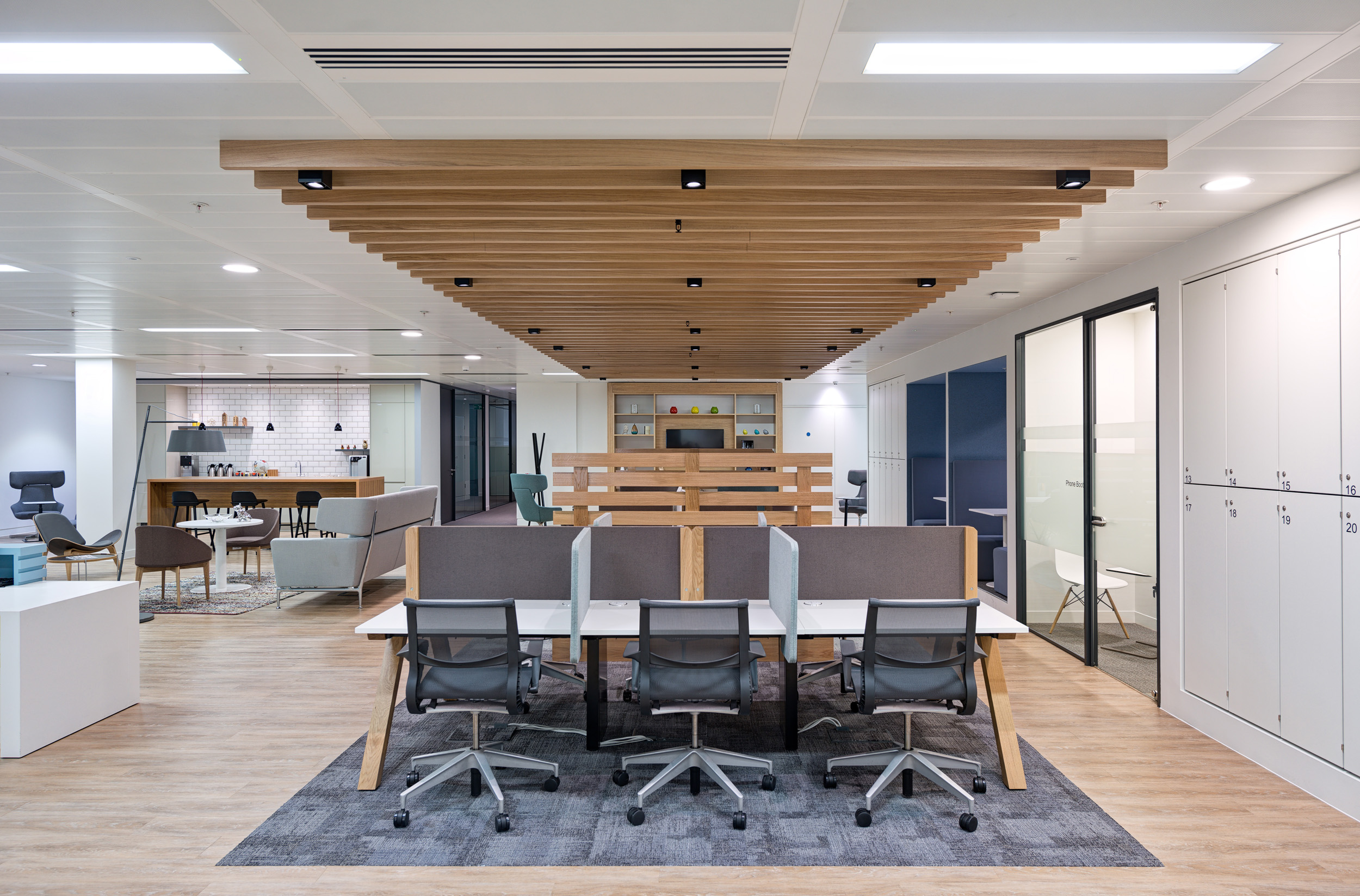 Open plan coworking desks with stylish ceiling design at Regus’ St Mary Axe office.