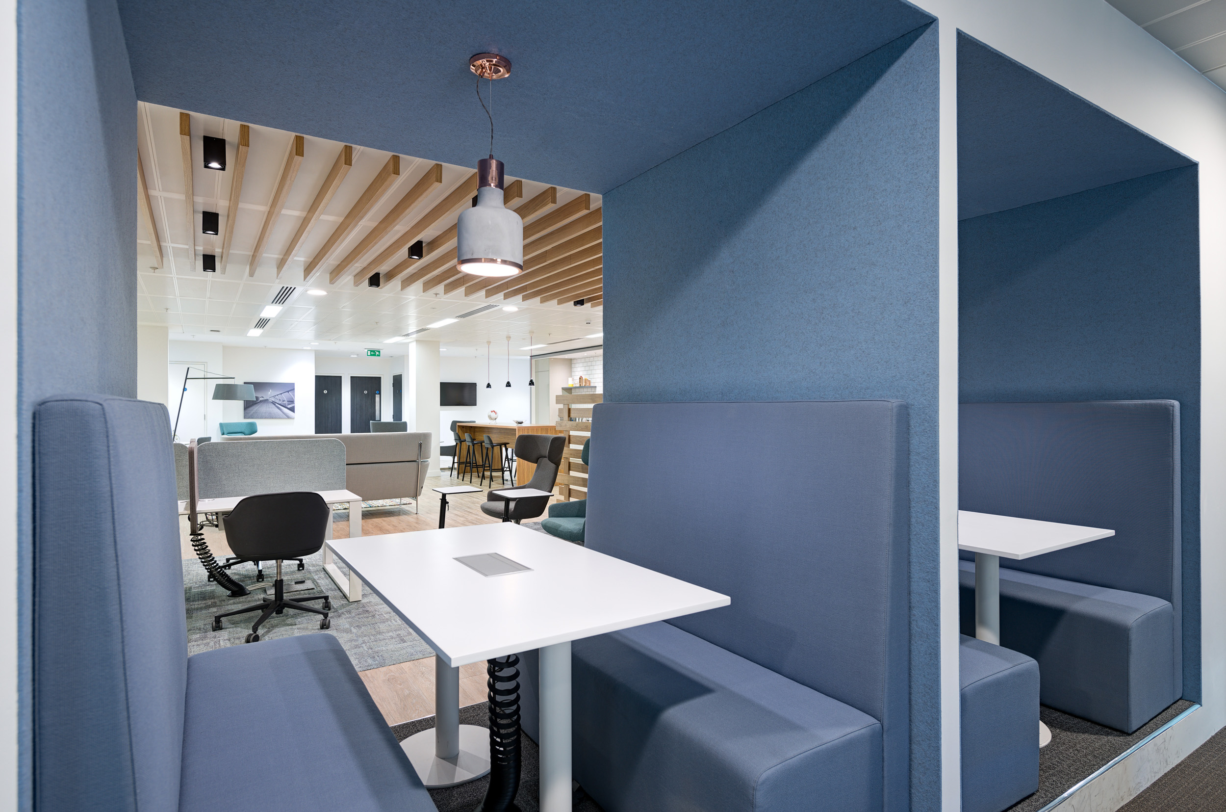 Private focus booths at Regus’s St Mary Axe workspace, offering a quiet space for work within the flexible office fit-out.