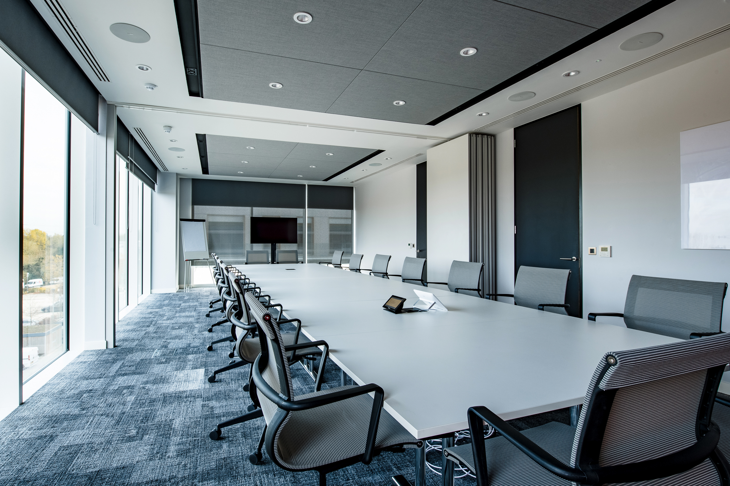 Large conference room with floor-to-ceiling windows, designed for Schindler Group's UK office at Bourne Business Park, Weybridge