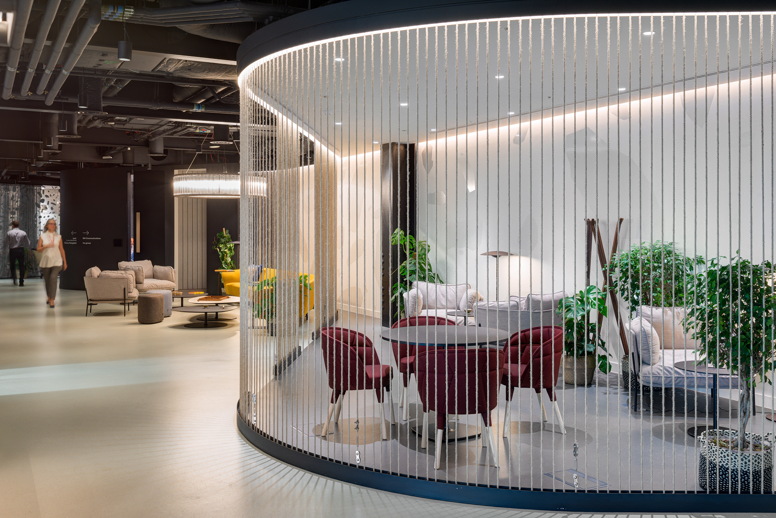 Storey Kingdom collaborative zone, with futuristic like panelling, curved edges and biophilic plants.