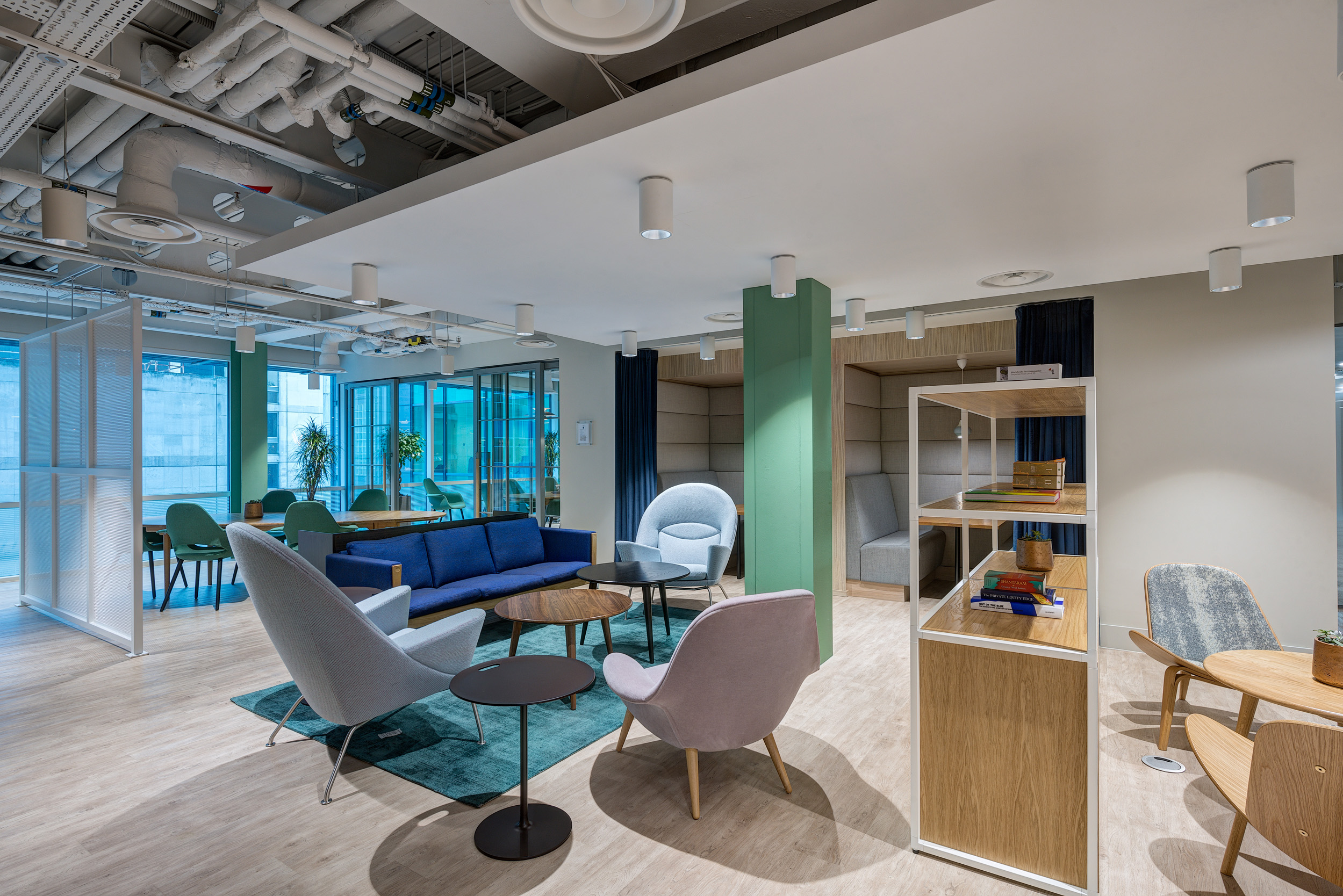 A comfortable breakout space at Vitruvian Partners’ office, offering a variety of seating options for informal meetings and relaxation in a thoughtfully designed environment.