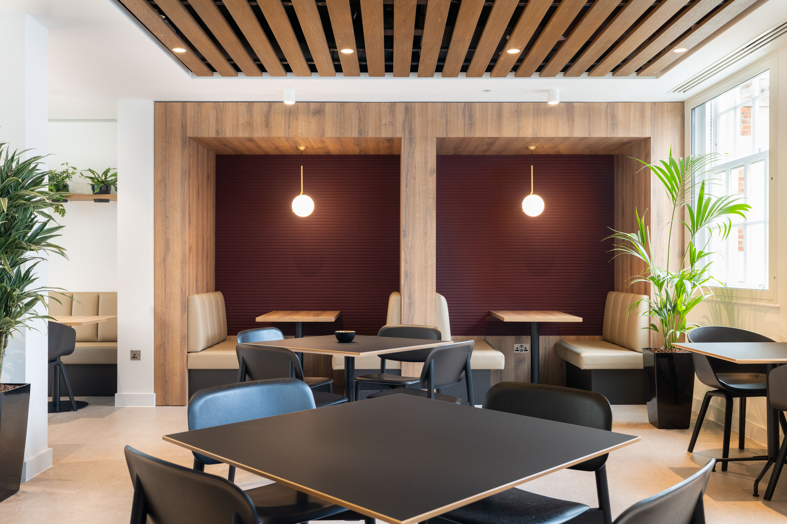 Cosy and private work booths in the Weatherbys office designed to provide employees with a comfortable place for informal meetings and breaks.
