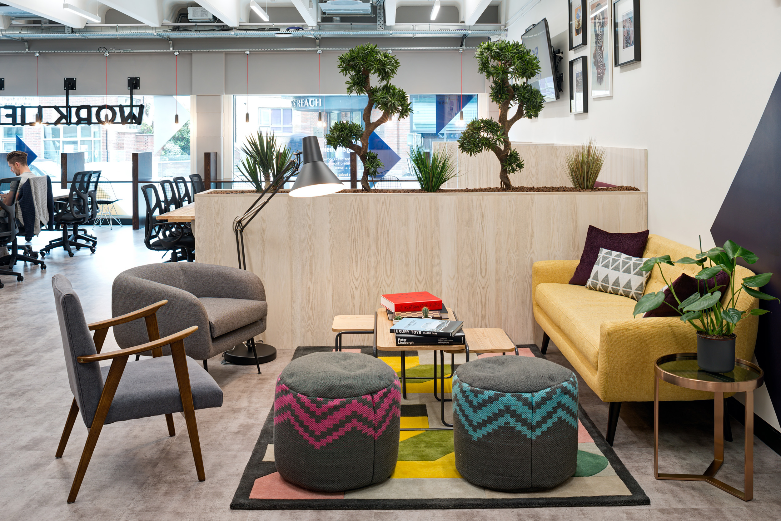 A cozy lounge area with comfortable seating and plants at Worklife Reading, creating a relaxed atmosphere, designed by Modus Workspace.