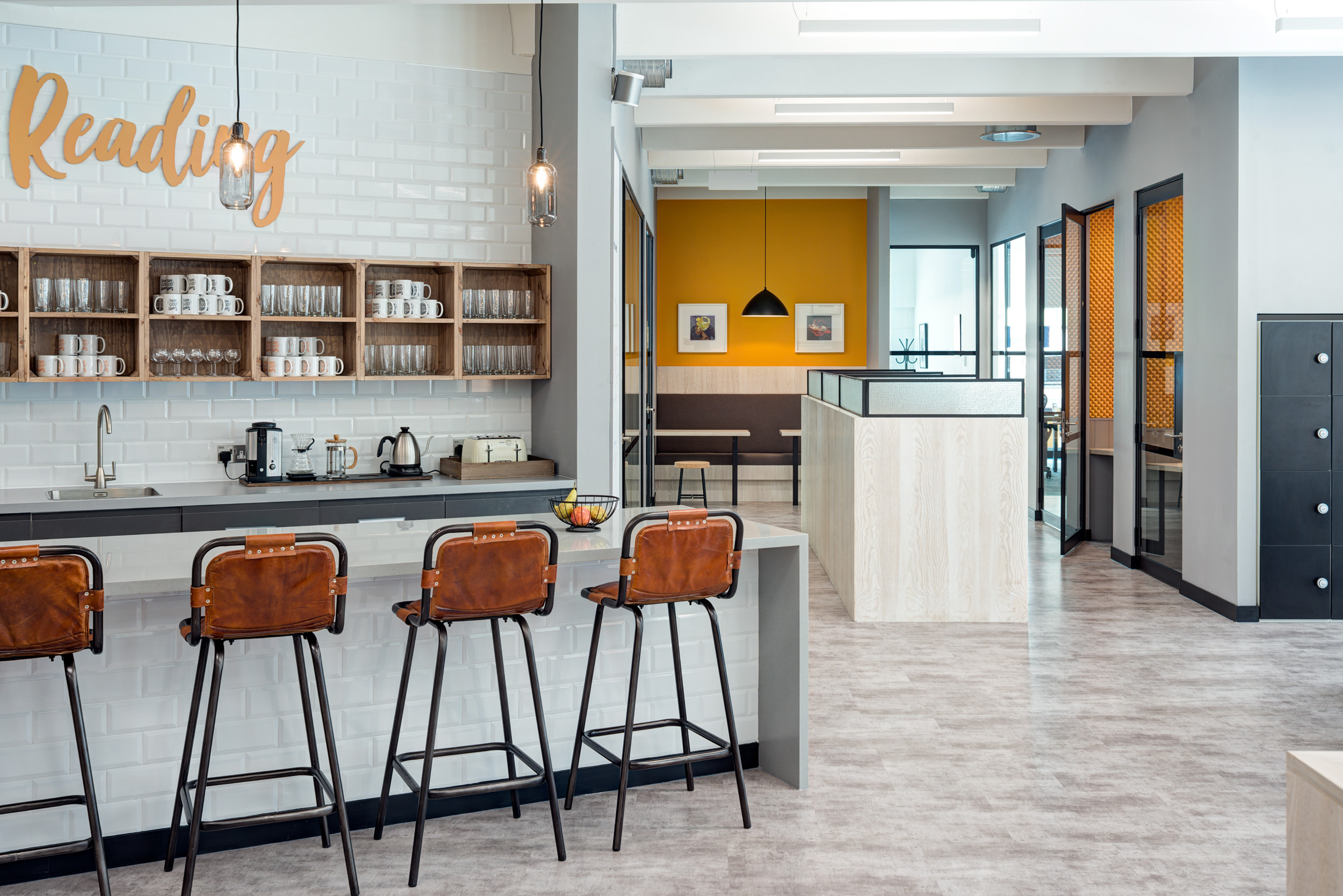The teapoint area at Worklife Reading, featuring bar stools and a 