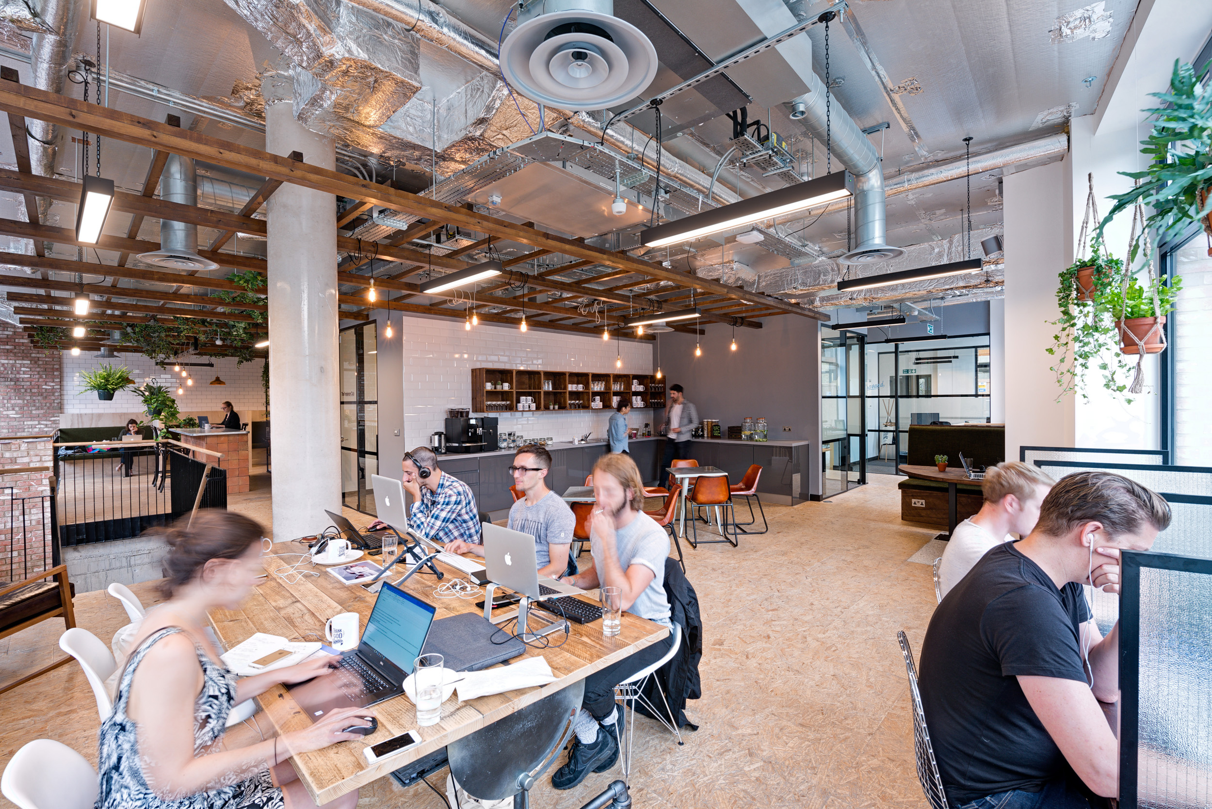 Worklife London Fields vibrant meeting room at Worklife London Fields, designed by Modus Workspace, featuring a custom mural and modern furnishings for creative brainstorming sessions.