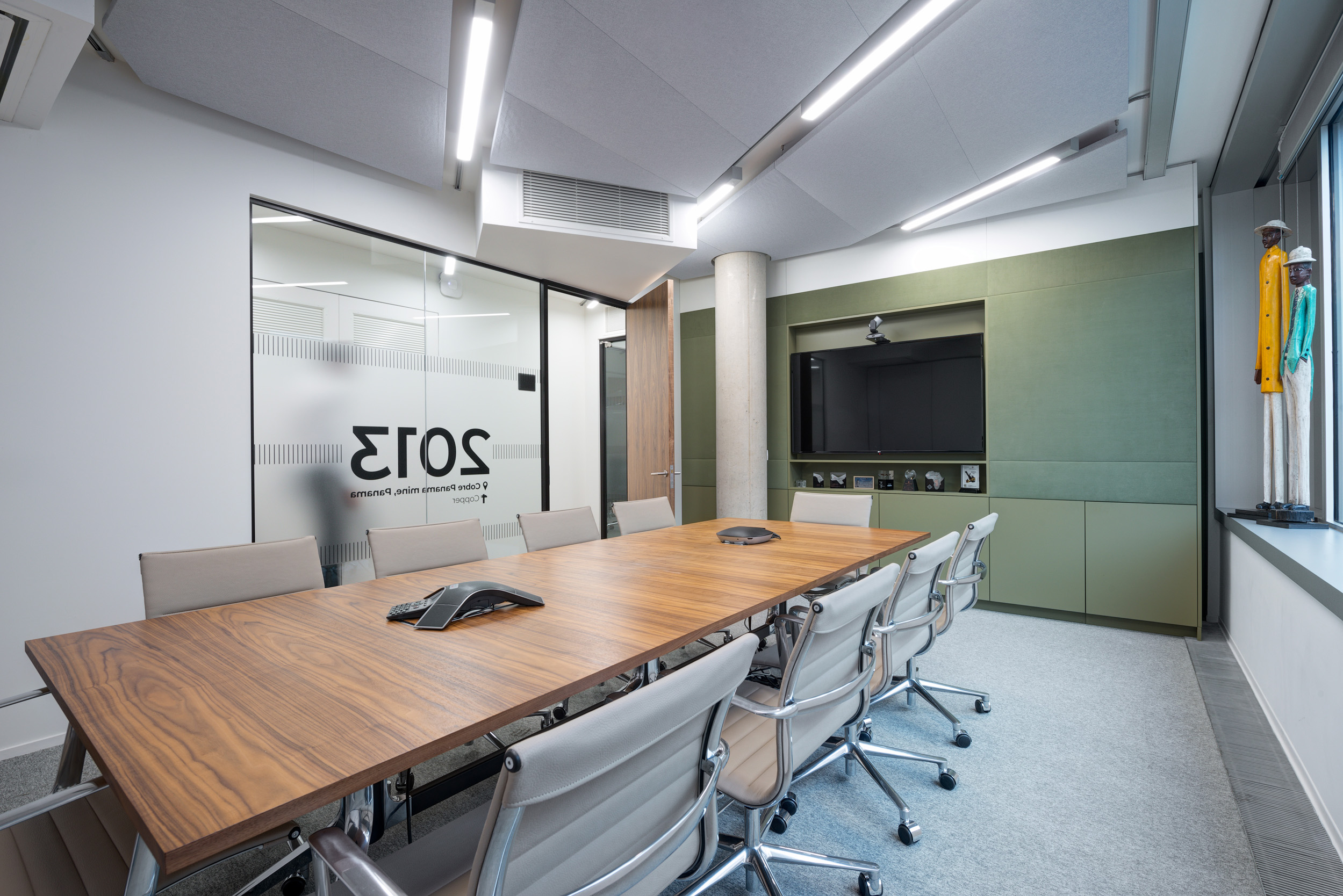 First Quantum Minerals bespoke boardroom featuring a ten seated table, a large screen and frosted glass partition.