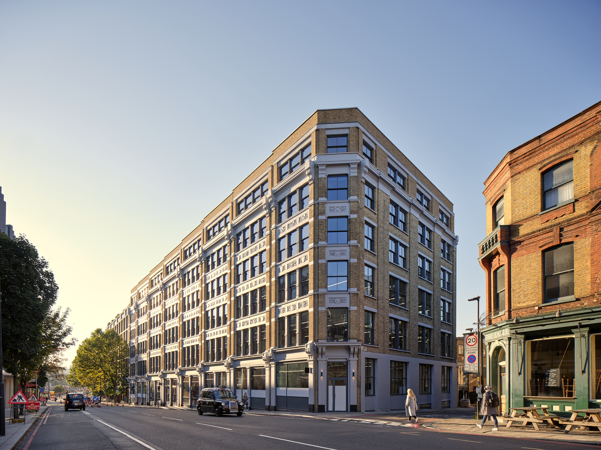 The Waterman exterior, a project completed by Ambit, Modus's sister company, showcasing the restored building's striking architecture under a clear sky.