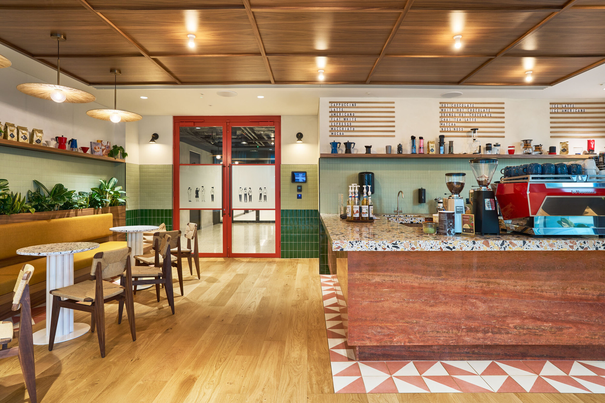 International Technology and Data Firm barista bar, with a funky 80s aesthetic, featuring bold colours, a terrazzo teapoint and spotlighting.