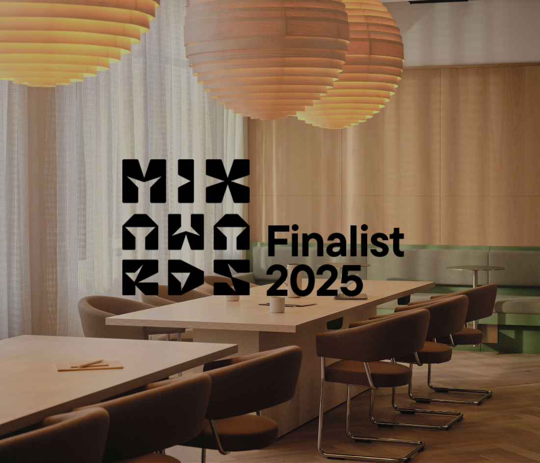 Modus shortlisted as a Mix Awards 2025 finalist. Warm, wood-accented workspace with layered lighting and collaborative seating.
